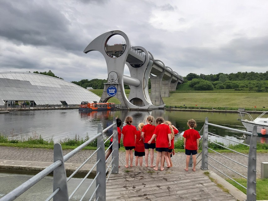 Girls watching barges